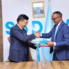 Chinese Ambassador to Somalia hands one Million dollars to SoDMA Commissioner